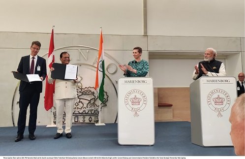PM Narendra Modi and his Danish counterpart Mette Frederiksen felicitating Dalmia Cement (Bharat) Limited's MD & CEO, Mahendra Singhi and Mr. Carsten Riisberg Lund, (2)