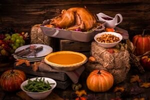 Roasted Thanksgiving Turkey with side dishes and autumn decoration