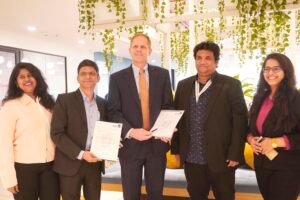 Dr Samala Nagaraju, Associate Dean of SoiM and Eric S. Armbrecht, Director at Saint Louis University seen exchanging MoU. Also seen is Ashok Kallam of Indo Global Studie pix 2